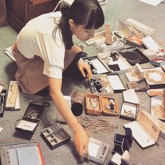 Marie Kondo organizing items on the floor